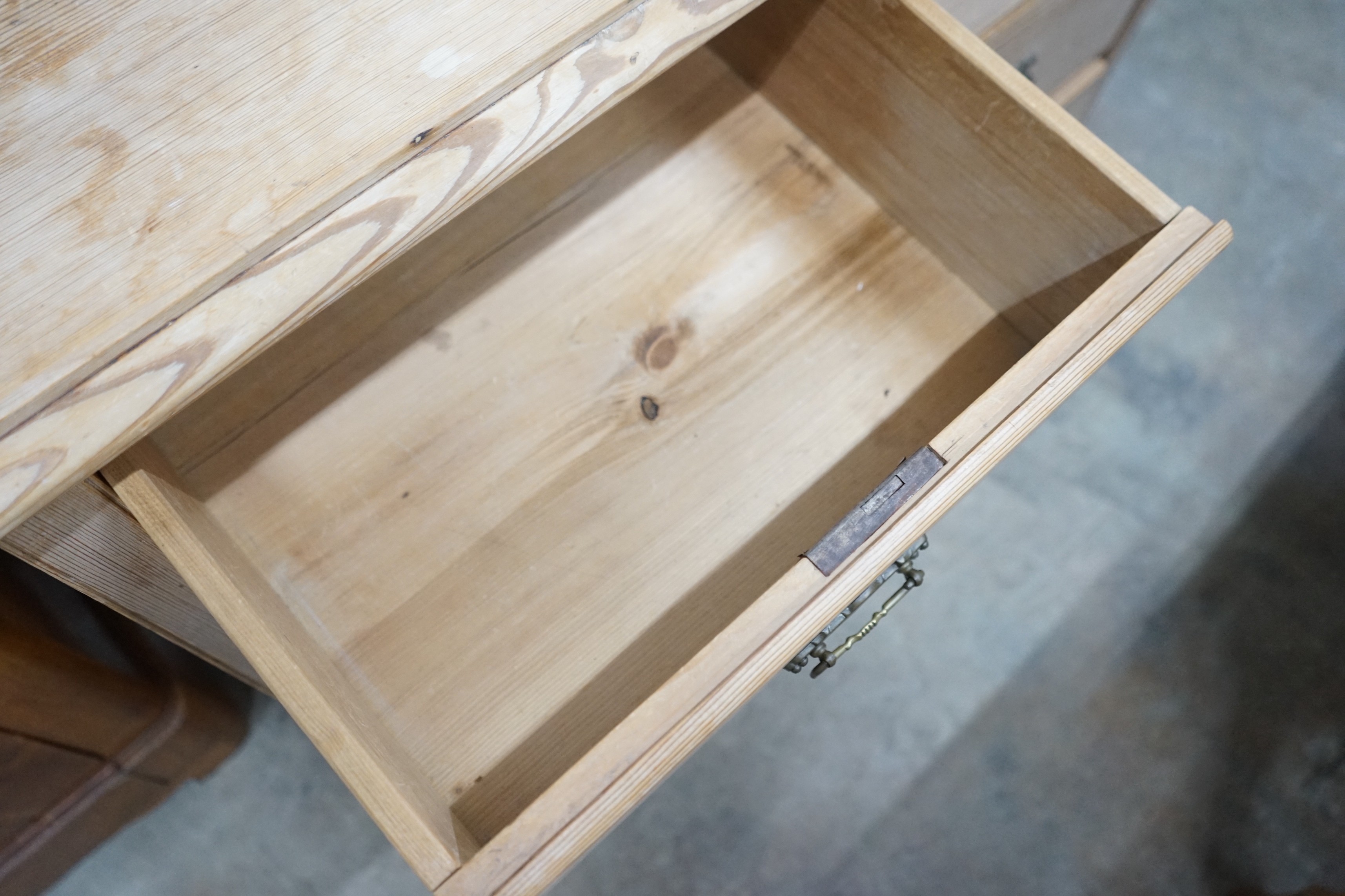 A late 19th century stripped pine dressing chest, fitted with two short and three long drawers, 551 cm high, 101 cm wide, 47 cm deep